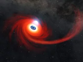 Bu resimde sıcak gaz diski bir kara deliğin etrafında dönüyor. Sağa doğru uzanan gaz akımı, kara delik tarafından parçalanan bir yıldızdan geriye kalanlardır. Kara deliğin üzerindeki sıcak plazma bulutu (elektronları sıyrılmış gaz atomları) korona olarak bilinir. Krediler: NASA/JPL-Caltech